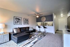 Everett apartment for rent - a living room with a couch and a glass coffee table