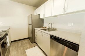 Everett apartment for rent - a kitchen with stainless steel appliances and white cabinets