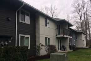 Lake Stevens apartment for rent - the front of a house with a yard and a balcony