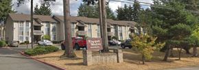 Kirkland apartment for rent - an apartment building with a sign in front of it