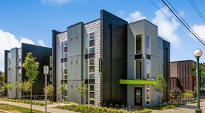 Seattle apartment for rent - a row of modern buildings with a street in front of them