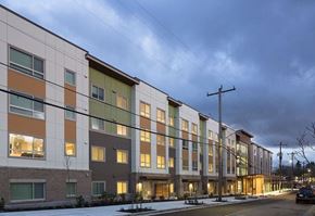 Seattle apartment for rent - a row of apartment buildings on a snowy street