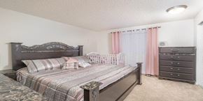Kent apartment for rent - a bedroom with a bed and a baby crib