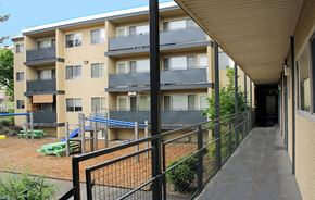 Seattle apartment for rent - the outside of an apartment building with a ramp and a playground