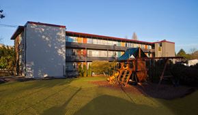 Seattle apartment for rent - a childrens playground in front of a building
