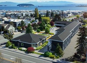 Anacortes apartment for rent - an aerial view of a small town with houses and a body of water