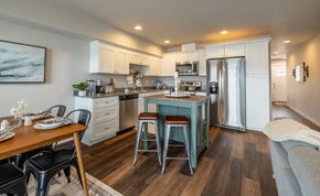 East Wenatchee apartment for rent - A modern kitchen with a dining table and chairs.