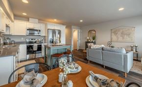 East Wenatchee apartment for rent - A modern kitchen with a dining table set for two.