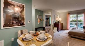 Mukilteo apartment for rent - a dining room table with plates and bowls on it