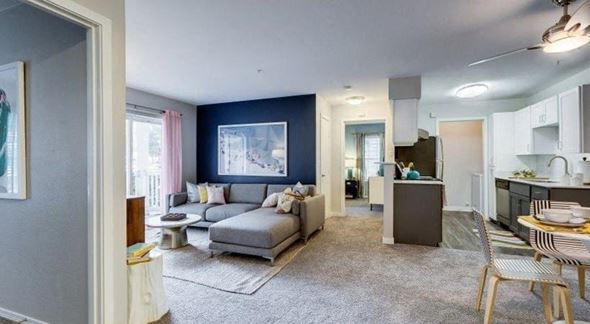 Mukilteo apartment for rent - a living room with a couch and a kitchen