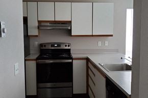 Marysville apartment for rent - an empty kitchen with a stove and a sink