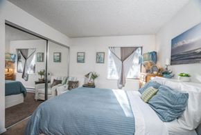 Federal Way apartment for rent - a bedroom with a large bed and a large window