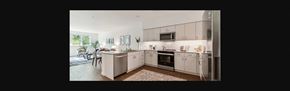 Mountlake Terrace apartment for rent - a view of a kitchen with white cabinets and a table