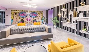 Quincy apartment for rent - a living room with a couch and a painting on the wall