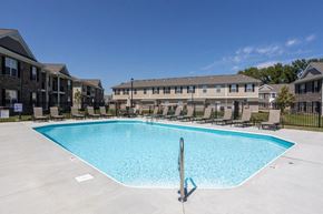 Lancaster townhouse for rent - a swimming pool in front of an apartment building