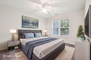 Dublin apartment for rent - A bedroom with a bed, nightstands, and a painting on the wall.