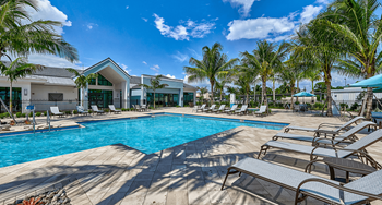 Large pool surrounded by lounge chairs
