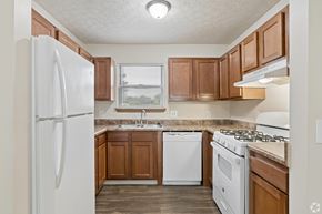 Blacklick apartment for rent - A fully equipped kitchen with appliances like refrigerator, stove, oven, and dishwasher, of an available home for rent at Cabot's Mill near Columbus, OH.