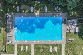 Butler apartment for rent - An aerial view of a swimming pool surrounded by lounge chairs.