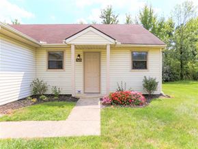 Blacklick apartment for rent - A small house with a brown door and windows.