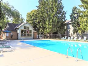 Blacklick apartment for rent - A pool with a building behind it.