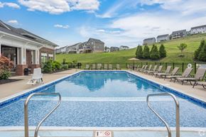 South Park apartment for rent - A swimming pool with a metal ladder and a red and white sign on the ground.