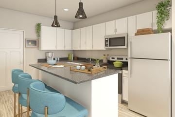 Delaware apartment for rent - A kitchen with a white refrigerator, a grey countertop, and blue chairs.