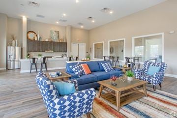 South Park apartment for rent - a living room with couches and chairs and a kitchen