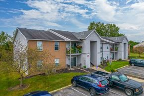 Marion apartment for rent - a condo building with cars parked in front of it
