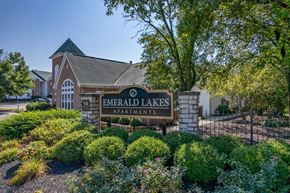 Beavercreek apartment for rent - exterior view of emerald lakes apartments sign in front of the building