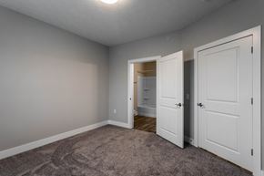 Hilliard apartment for rent - a bedroom with a closet and a door to a bathroom