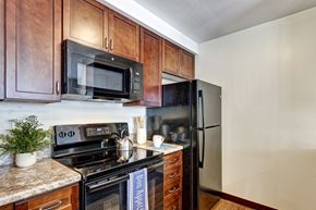 Suffield apartment for rent - Kitchens are well appointed with modern countertops, tasteful black appliances, and design cabinetry.