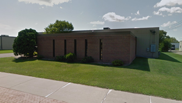 Minneapolis apartment for rent - an old brick building with a lawn in front of it