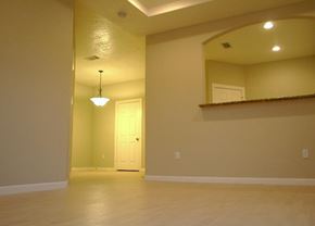 Houston apartment for rent - A room with a door and a mirror on the wall.