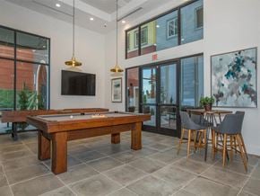 Oxnard apartment for rent - a game room with a pool table and a tv