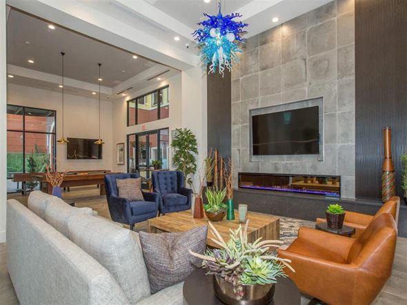 Oxnard apartment for rent - a living room with couches and chairs and a television