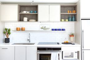 Washington apartment for rent - a white kitchen with white cabinets and a sink