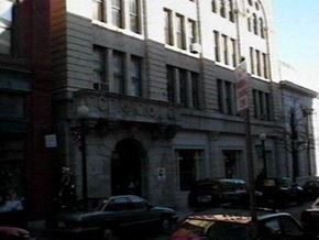 New Bedford apartment for rent - a large building on a city street with cars