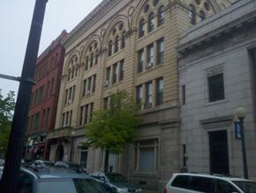 New Bedford apartment for rent - a building on a city street with cars and a tree