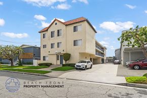 Hawthorne apartment for rent - A building with the words "Beach Front Property Management" on the bottom left corner.