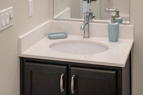 Vancouver apartment for rent - a bathroom with a sink and a mirror