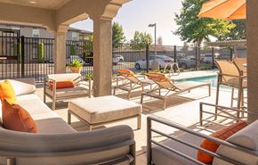 Ripon apartment for rent - Lounge Chairs by Pool | Villagio Apartments in Ripon, CA 95366
