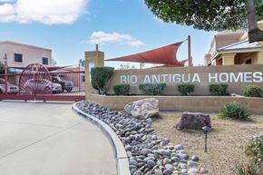 Tucson apartment for rent - A sign that says "BIO ANTIGUA HOMES" is in front of a building.