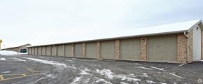 Algoma apartment for rent - a large garage with closed doors in a parking lot