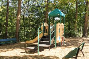 Silver Spring apartment for rent - a playground with a slide and benches in a park