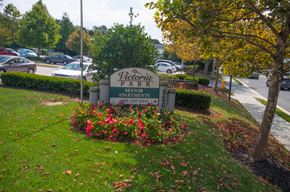 North East apartment for rent - the sign for victory park in front of a parking lot