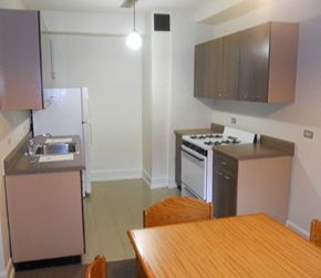 Chicago apartment for rent - a kitchen and dining room with a wooden table