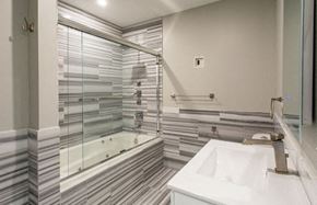 Pittsburgh apartment for rent - A white sink is in front of a mirror in a bathroom.