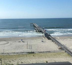 Ventnor apartment for rent - a pier on a beach next to the ocean