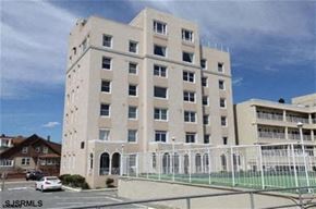Ventnor apartment for rent - a white building with a fence in front of it